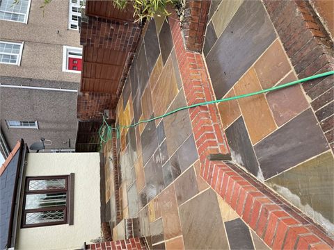 Paved patio with brick-edged changes in level