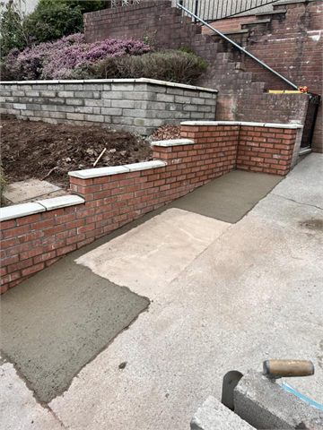 Front garden retaining walls and steps beside a path